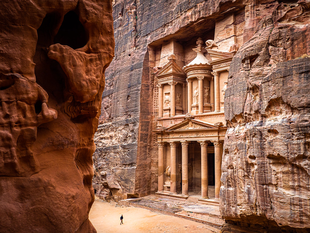 Petra, the rose-red city carved into the cliffs of Jordan! It's a place of immense beauty and mystery, captivating travelers for centuries with its intricate architecture, fascinating history,